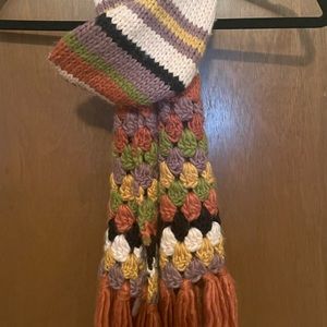 Multicolor chunky knitted wool scarf with striped design.